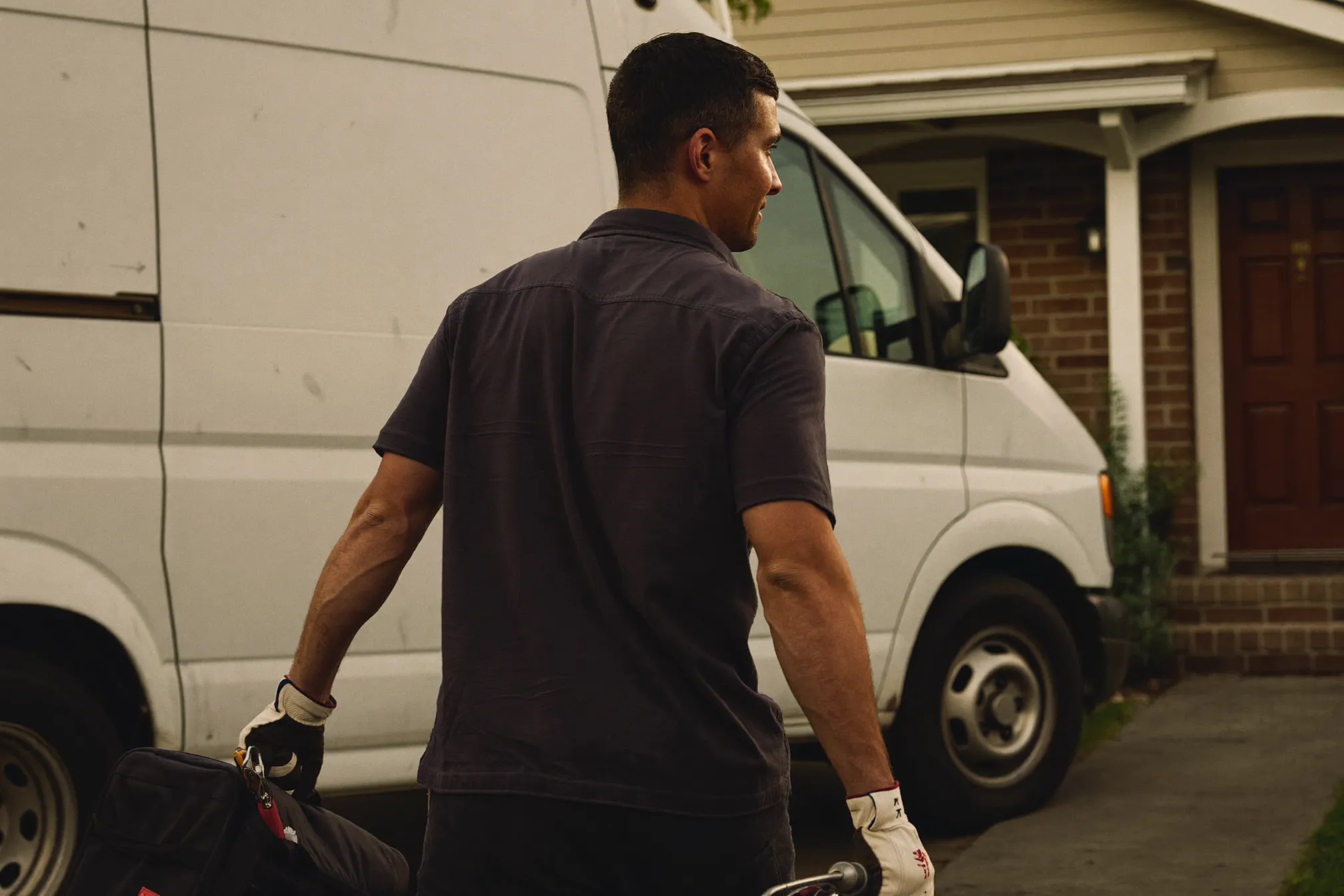 A Rivera Plumbing service van parked in a Sacramento driveway at golden hour